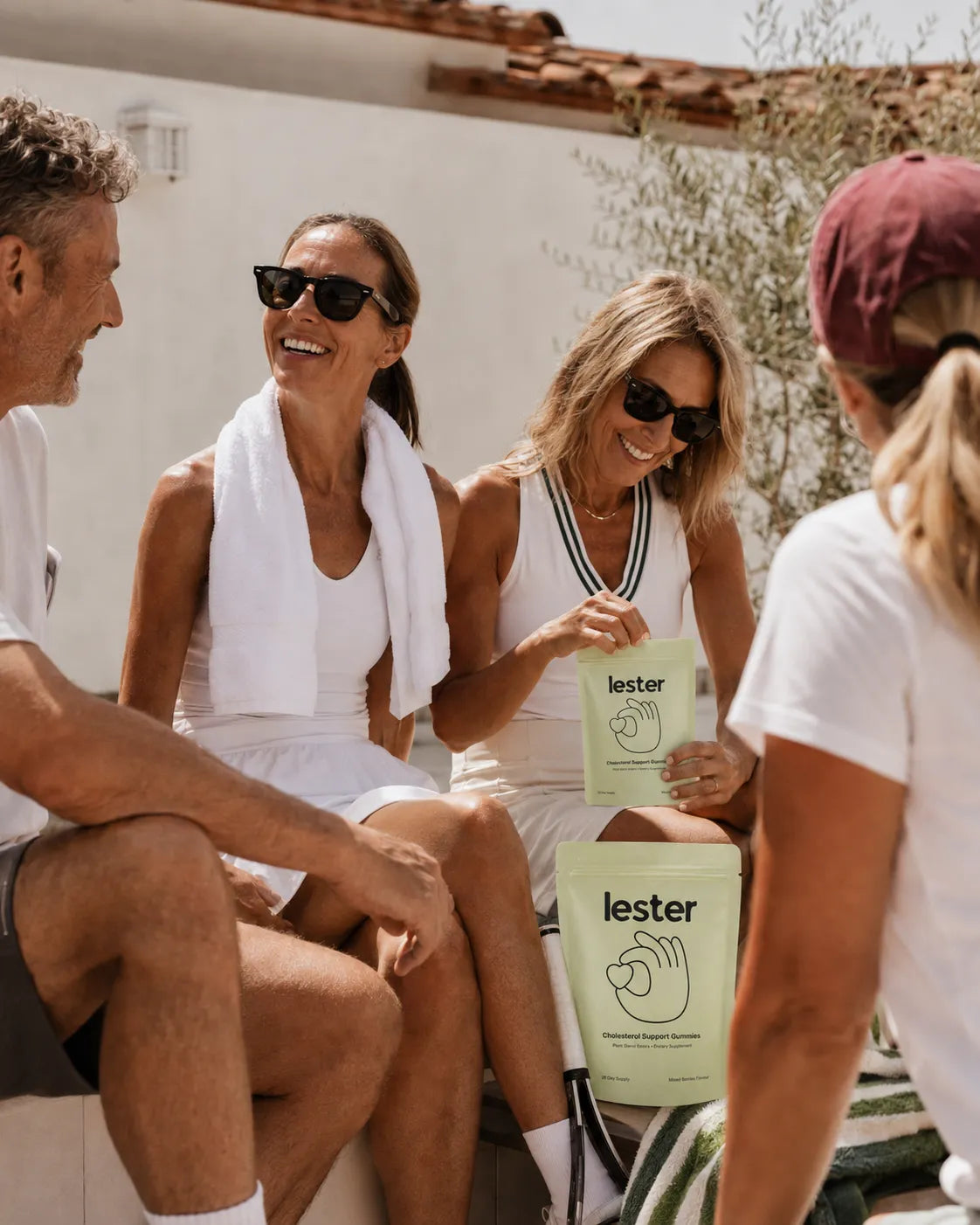 Friends enjoying Lester cholesterol support gummies outdoors
